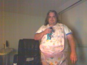 Me in my bib with my dinosaur Eeyore.