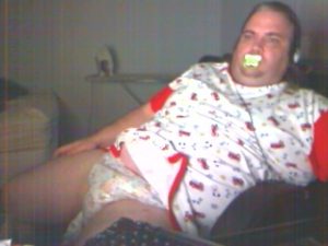 Baby shows his diaper.